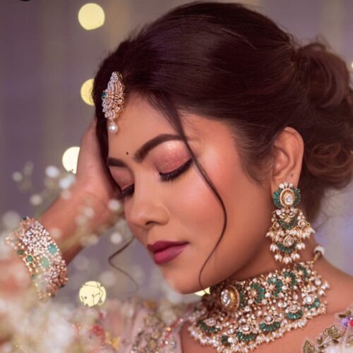 Glamorous bridal reception makeup with flawless finish