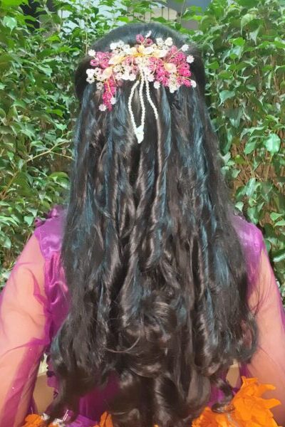 perfect hairstyle with curls and flower